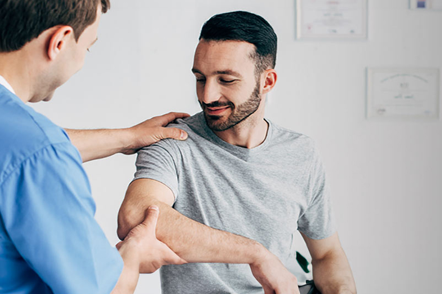 patient being helped by physical therapist